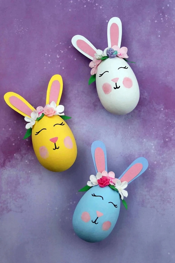 Handcrafted Bunny Easter Eggs with floral crowns and rosy cheeks.
