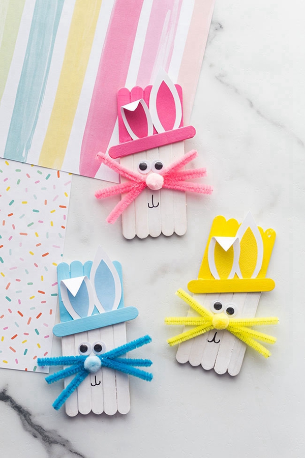 Colorful popsicle stick bunnies, a fun and creative Easter craft for kids.