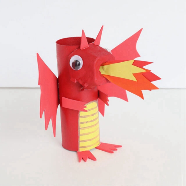 Child's crafted fire-breathing dragon from a toilet paper roll