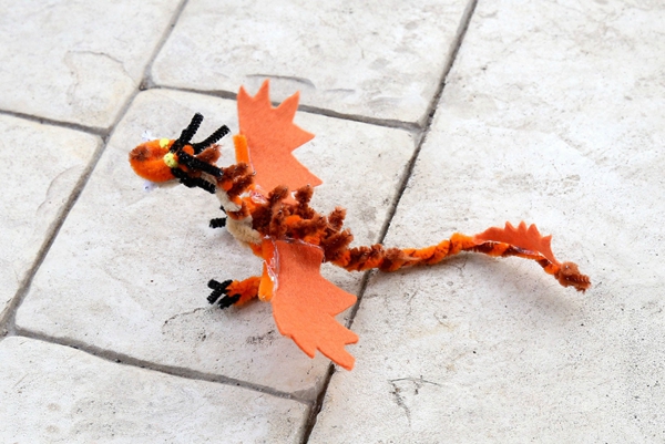Kids' crafted dragons from 'How to Train Your Dragon' using felt and pipe cleaners