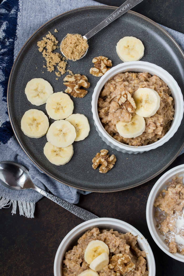 A warm and inviting bowl of Crock-Pot Banana Bread Oatmeal, rich with the flavors of ripe bananas and warm spices, offering a nutritious and comforting start to the day.