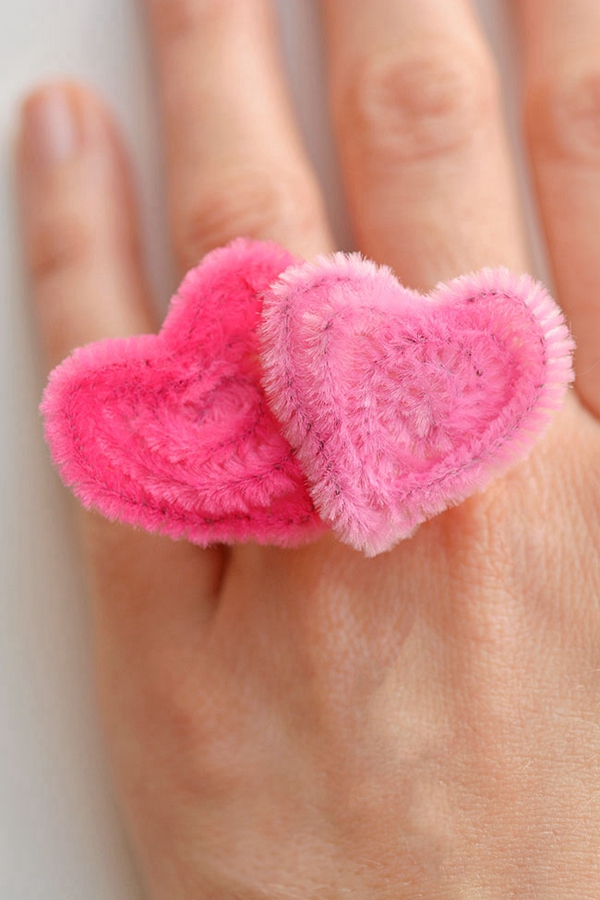 Handmade pipe cleaner heart rings, an easy and fun Valentine's Day craft.