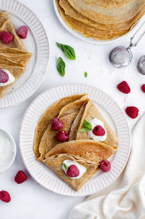 Buttery almond milk crepes topped with fruits and yogurt for a nutritious breakfast.