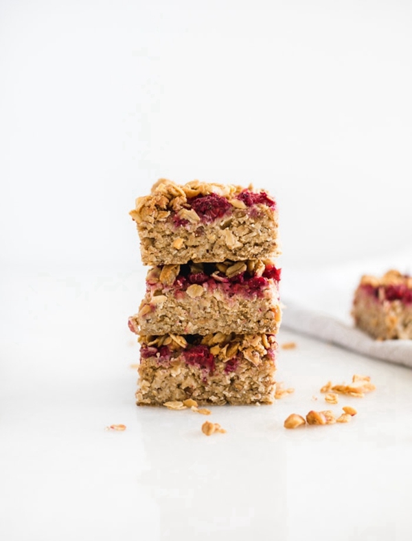 Delicious PB&J Baked Oatmeal Bars with raspberries and peanut butter on top, perfect for a healthy breakfast or snack.