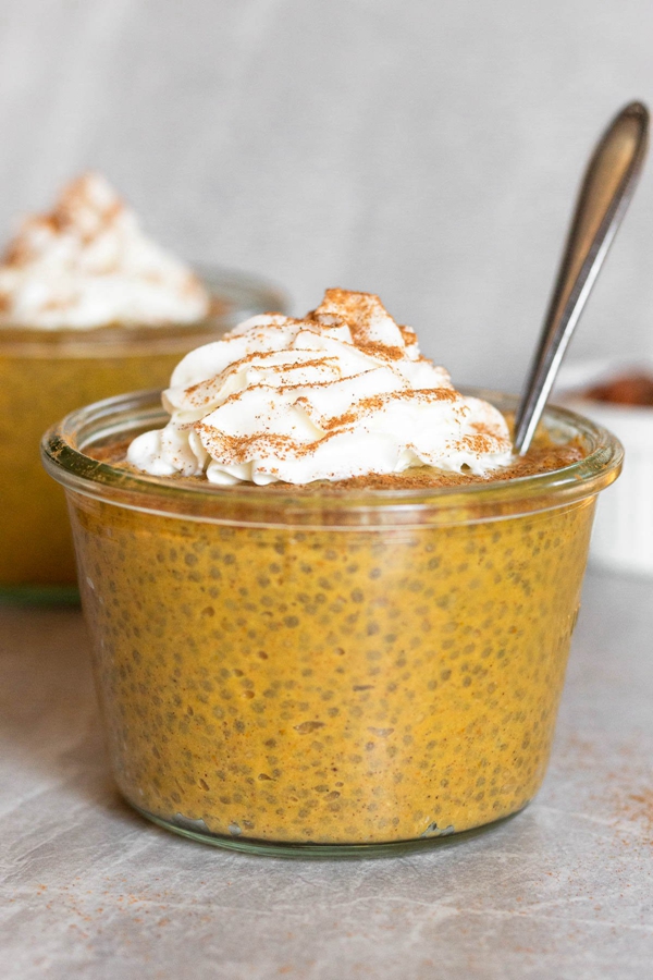 Bowl of Healthy Pumpkin Chia Pudding, reminiscent of pumpkin pie flavors.