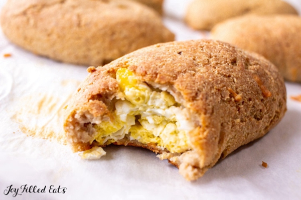Delicious and convenient Keto Breakfast Pockets, ideal for a ketogenic diet, showcasing a golden, mozzarella-based dough filled with savory breakfast meats and cheeses.