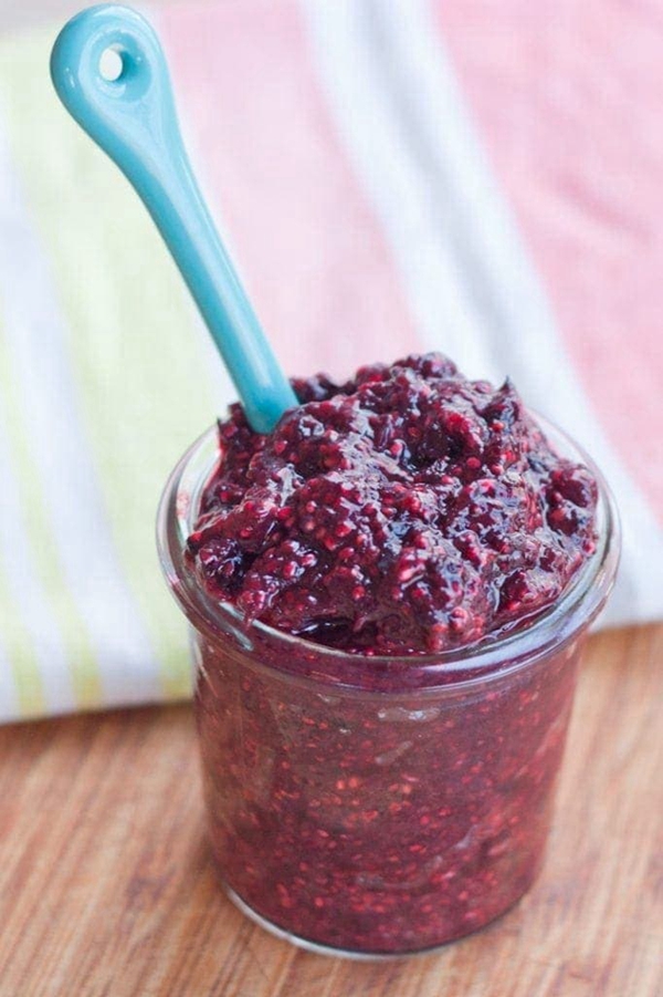 A jar of homemade Mixed Berry Chia Seed Jam, bursting with natural berry flavors and healthy ingredients.