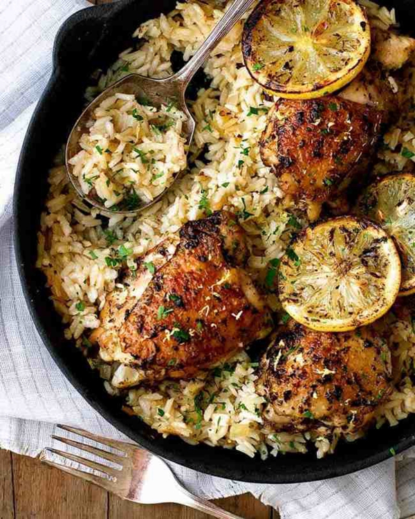 A pot of Greek Chicken and Lemon Rice, showcasing the tender chicken and flavorful rice.