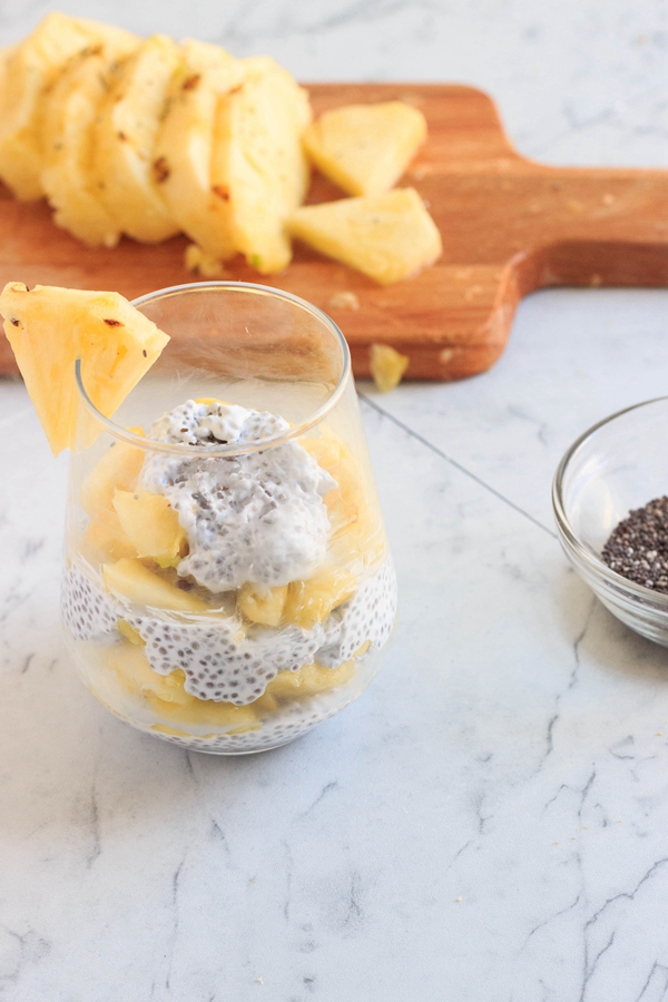 A tropical jar of Piña Colada Chia Pudding, blending pineapple and coconut for a refreshing breakfast.